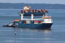 The MV Eemslift Nadine arriving at the Port of Everett on Monday. The containers on top are full of Rad Power e-bikes. Photo: Leland Dart