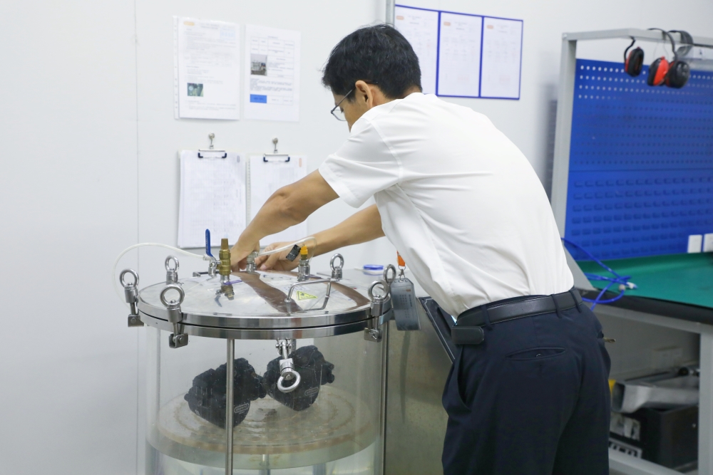 An engineer operating the air tightness tester